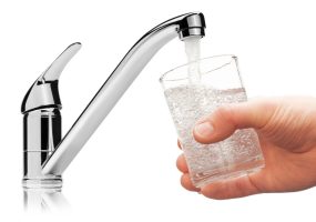 Glass filled with drinking water from tap, isolated on the white background.